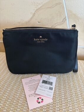 kate spade black nylon wristlet with gold logo